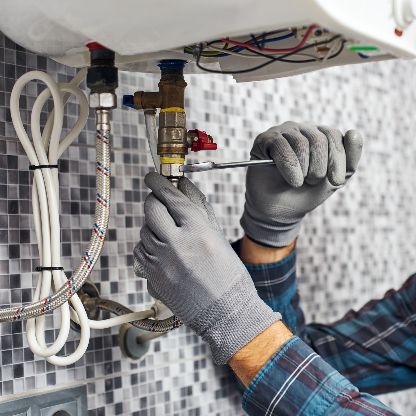 A worker fixing up an electric furnace.